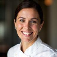 Professional photo of Chef Maria Popescu, smiling warmly.